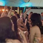 Bridesmaids dancing at Lanikuhonua